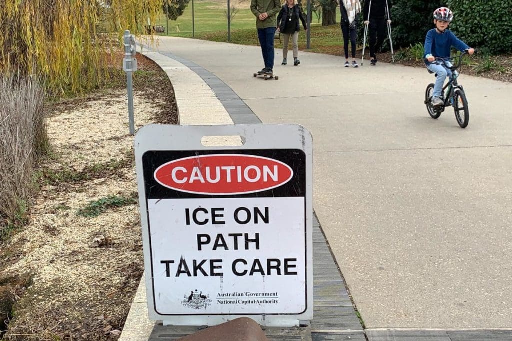 Ice on path take care sign
