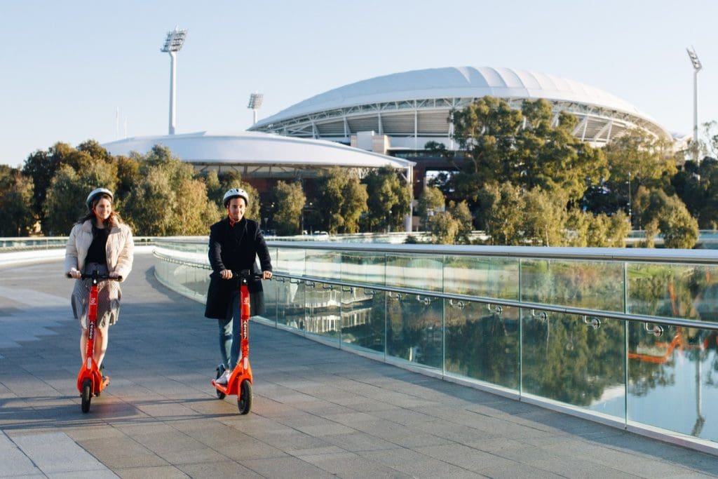 Riders taking advantage of the e-scooter share scheme to cross the Adelaide Riverbank Pedestrian Bridge. More than 460,000 e-scooter trips were undertaken through the scheme during the first six months of 2021.