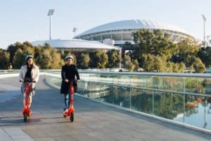 Riders taking advantage of the e-scooter share scheme to cross the Adelaide Riverbank Pedestrian Bridge. More than 460,000 e-scooter trips were undertaken through the scheme during the first six months of 2021.