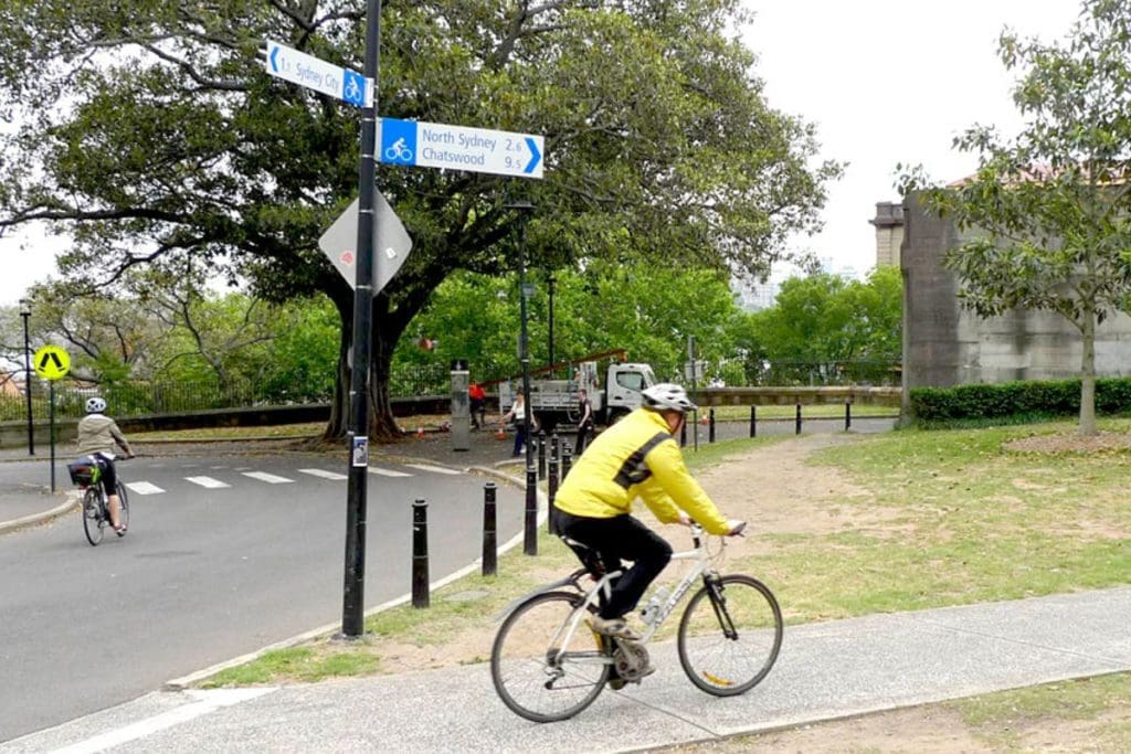Sydney riders follow the standardised signage outlined in the Austroads Bicycle Wayfinding report