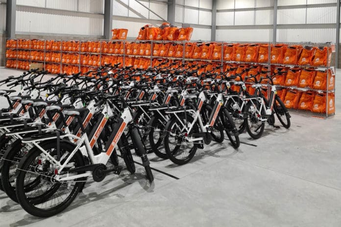 fleet of Zoomo e-bikes