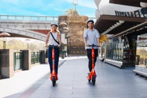 People riding e-scooters in the city