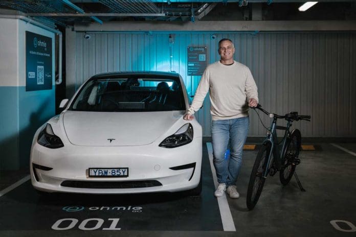OhmieGO founder and CEO Kyle Bolto with electric vehicles
