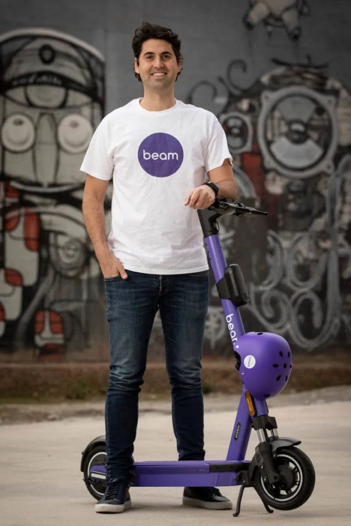 Tom Cooper with e-scooter