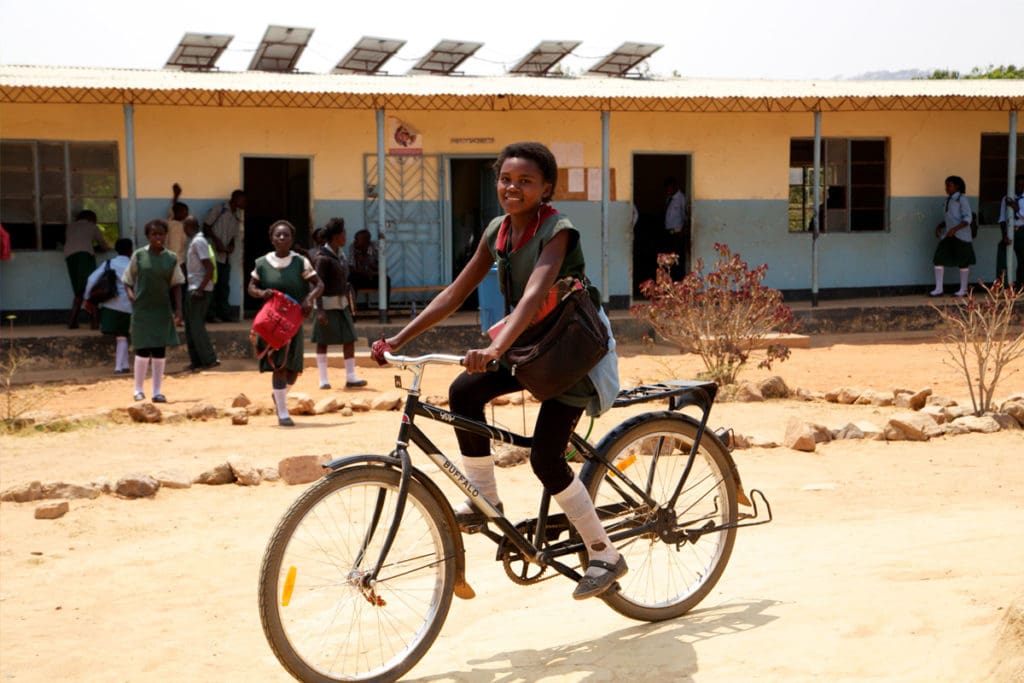 Child riding bike from World Bicycle Relief Program