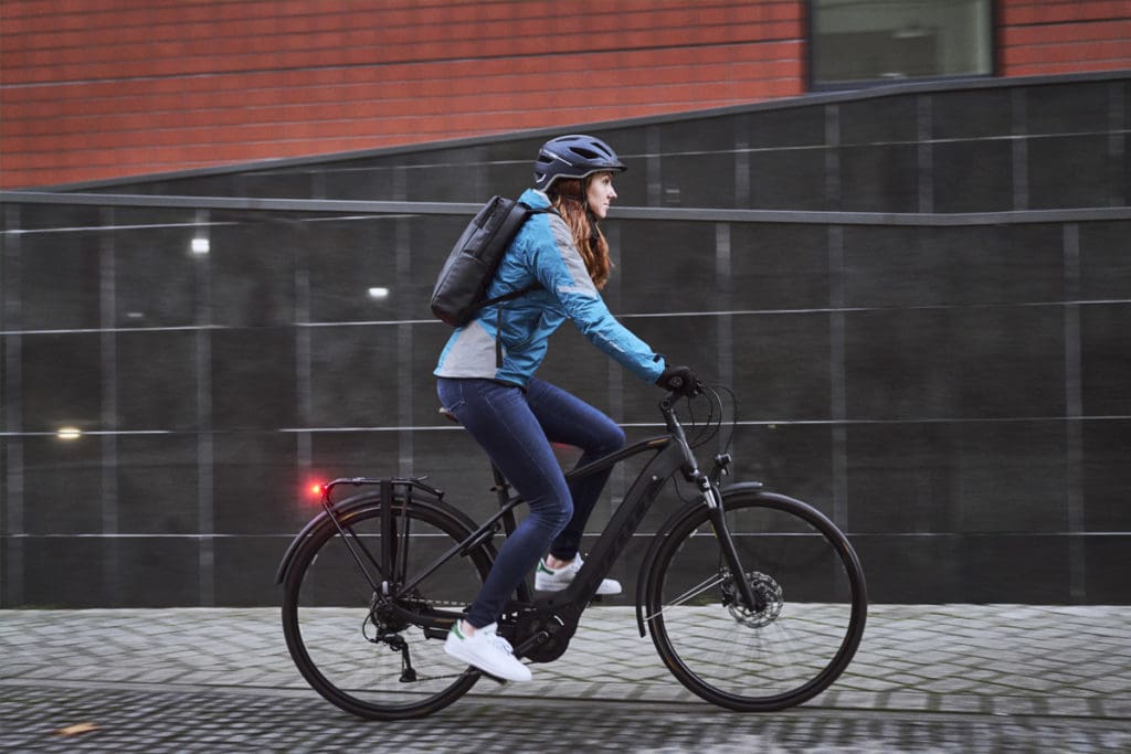 Person riding e-bike in city