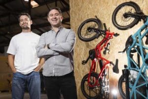 Two men standing with Tern ebikes