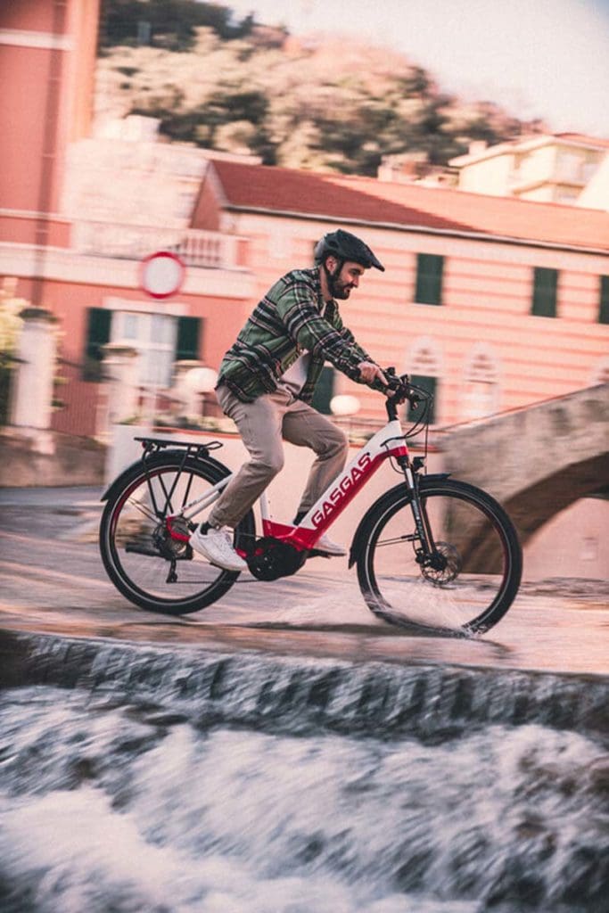 person riding bike through city