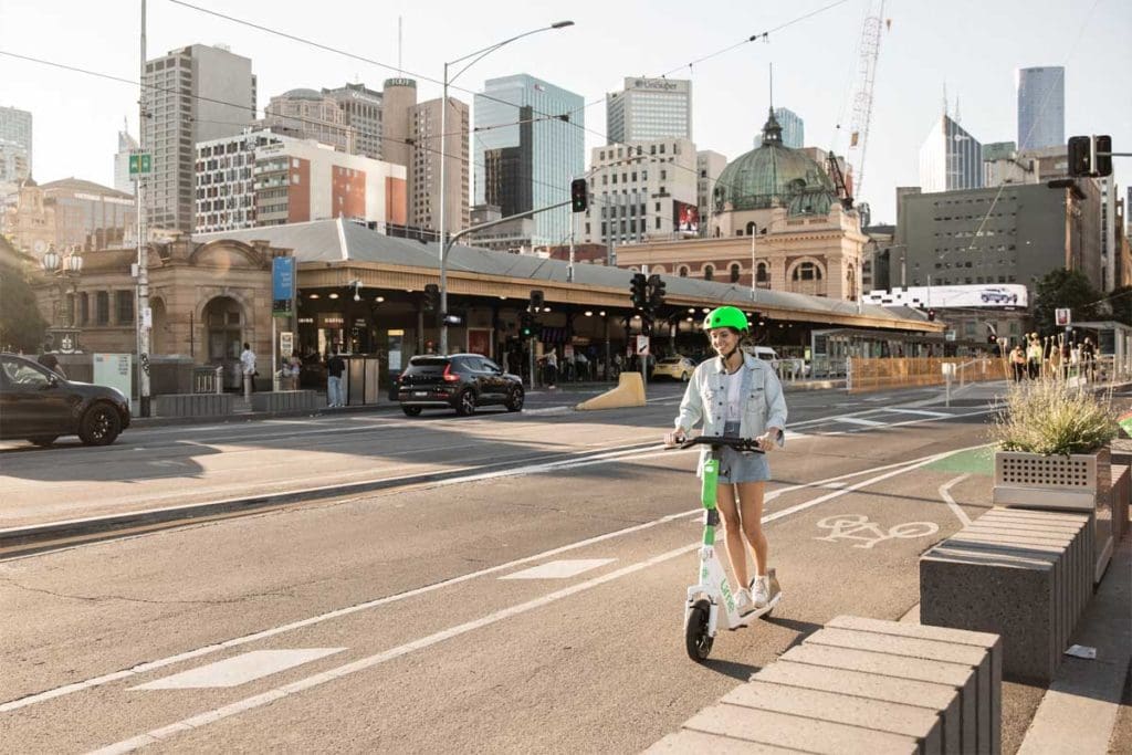 Person riding e-scooter on a Melbourne street