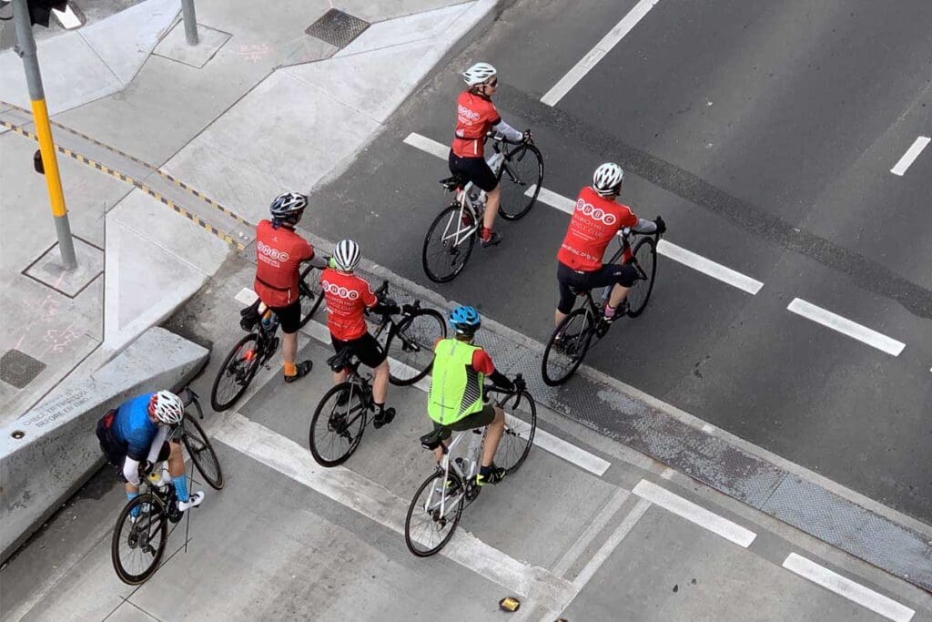 Aerial view of cyclists on road.