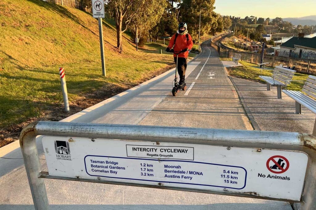 Person riding e-scooter on Hobart cycleway