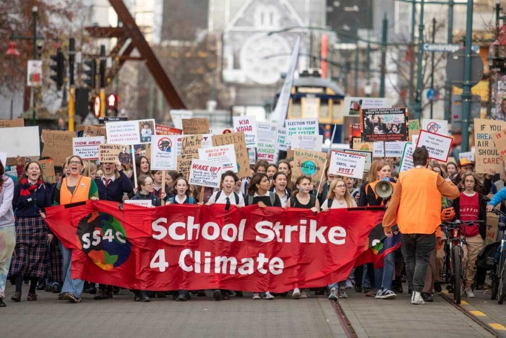 School children protesting on a city street
