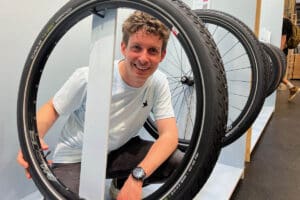 Man posing with tyre display