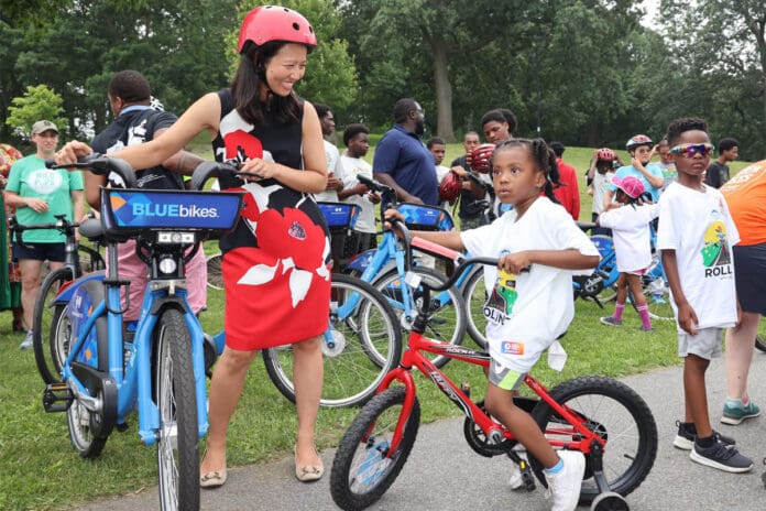 Boston Mayor with children riding bikes