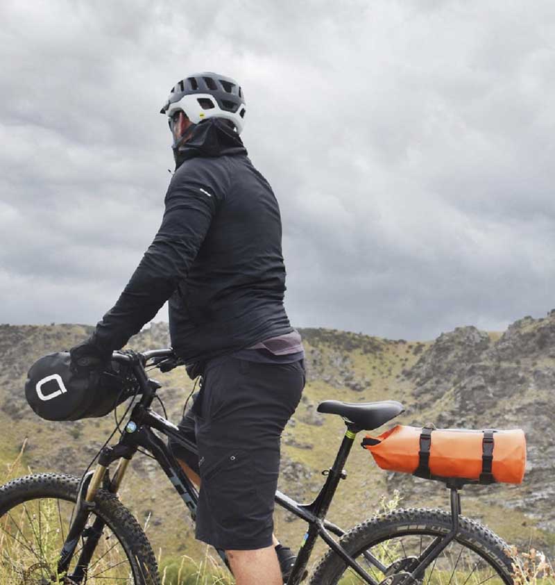 Person with bike with mountain in background
