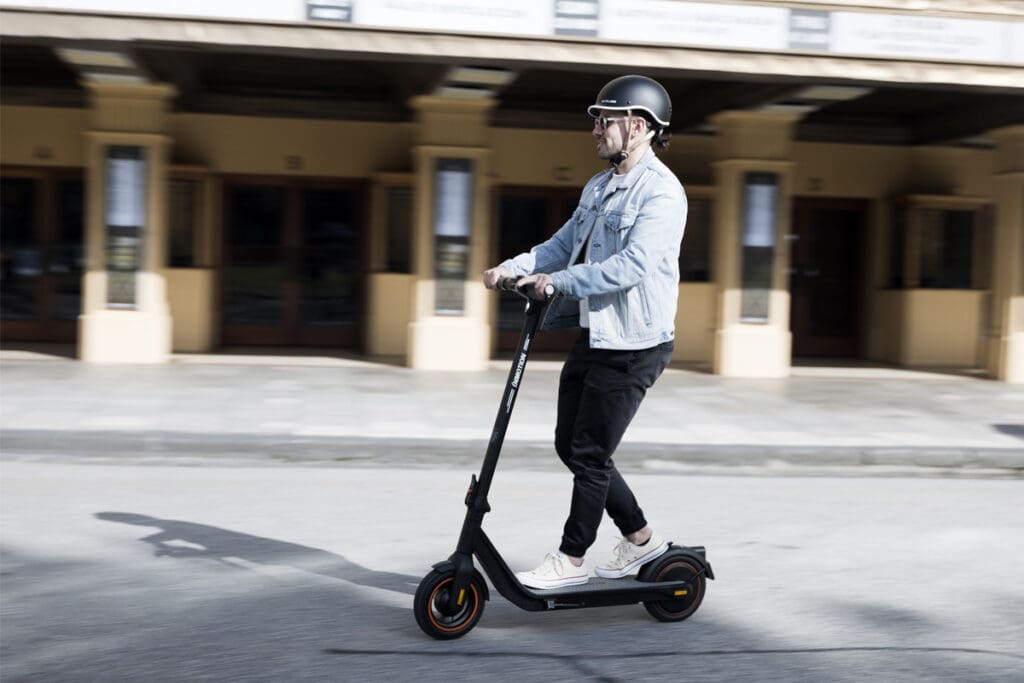 Person riding e-scooter in city
