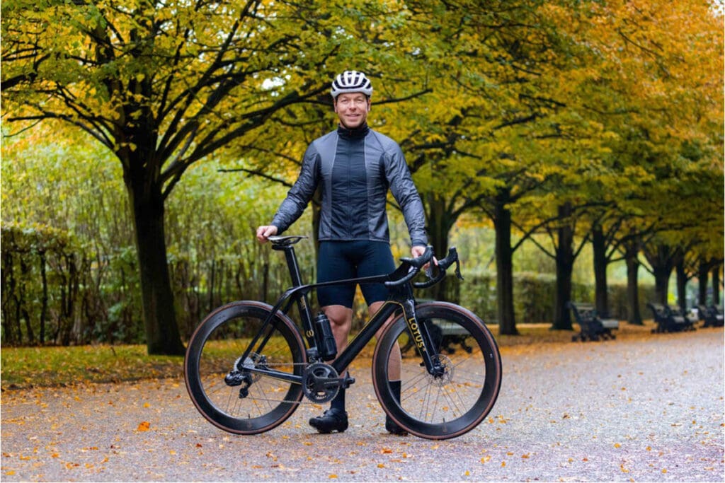 Man standing with eBike outdoors