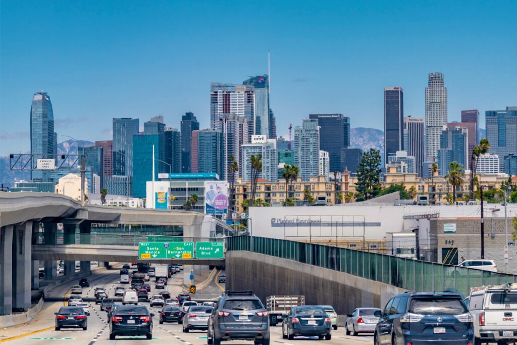 California highway with city scape in background