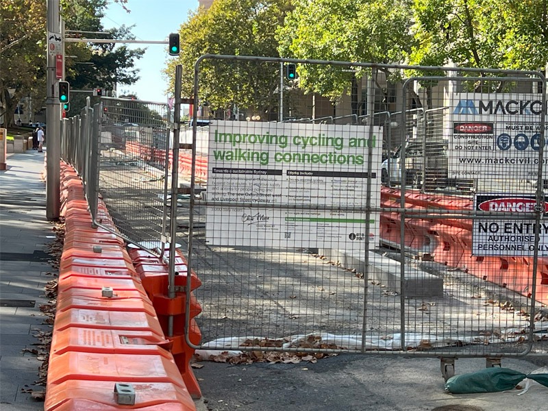 This photo was taken on 31st March 2024 showing construction underway of the new Oxford St / Liverpool St protected cycleway as shown from Liverpool St at the southern boundary of Hyde Park.