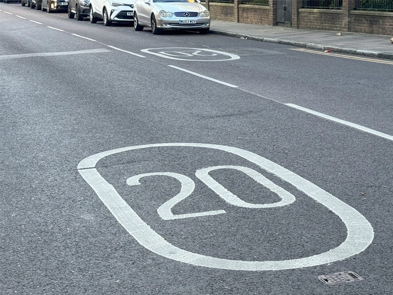 20 speed sign painted on road