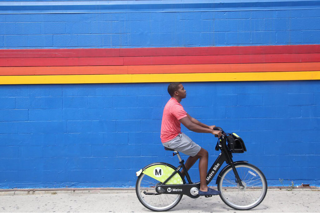 Person riding a share scheme bicycle