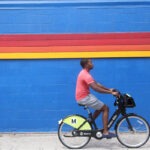 Person riding a share scheme bicycle