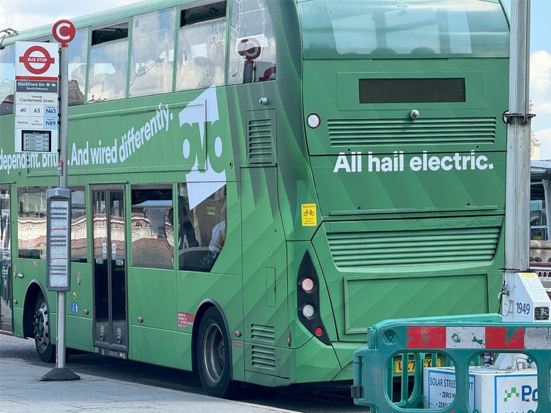 Electric double decker bus on street