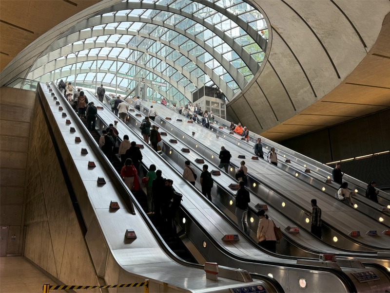 Escalators taking people to and from an underground station