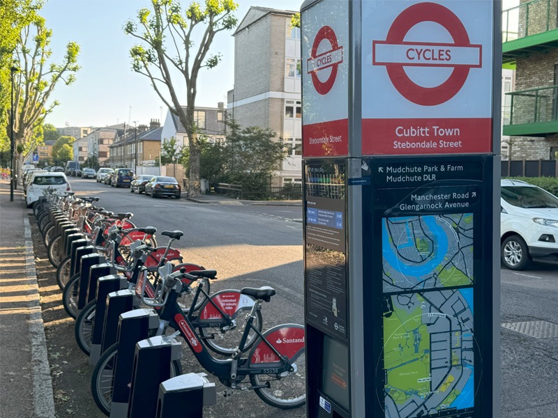 A line of parked share bicycles