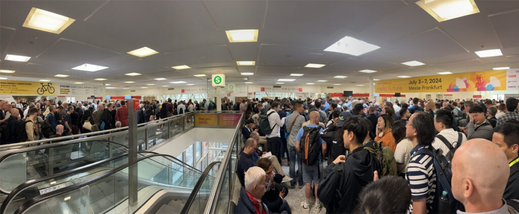 Large group of people waiting to enter expo