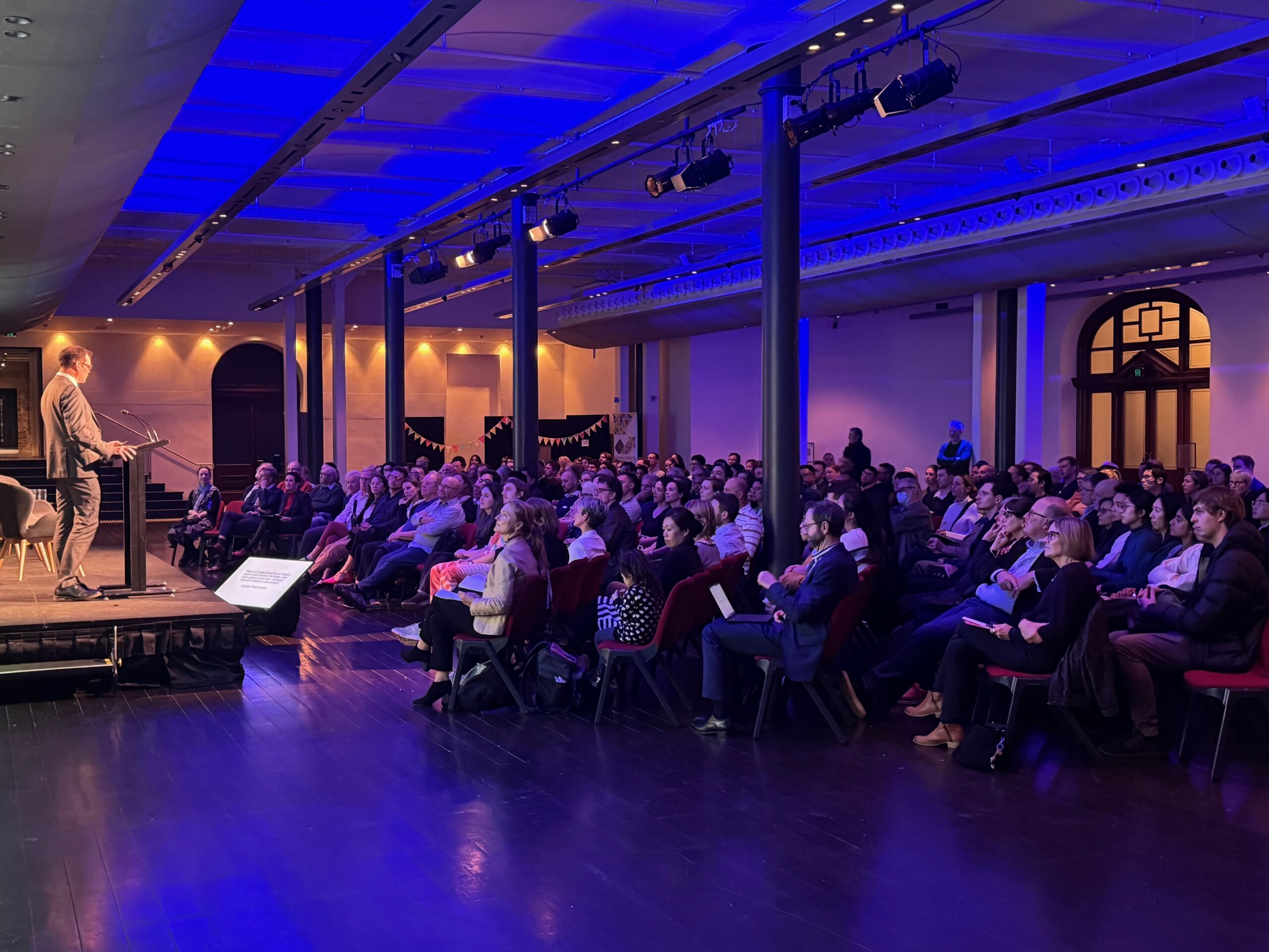 Wide shot of full conference room