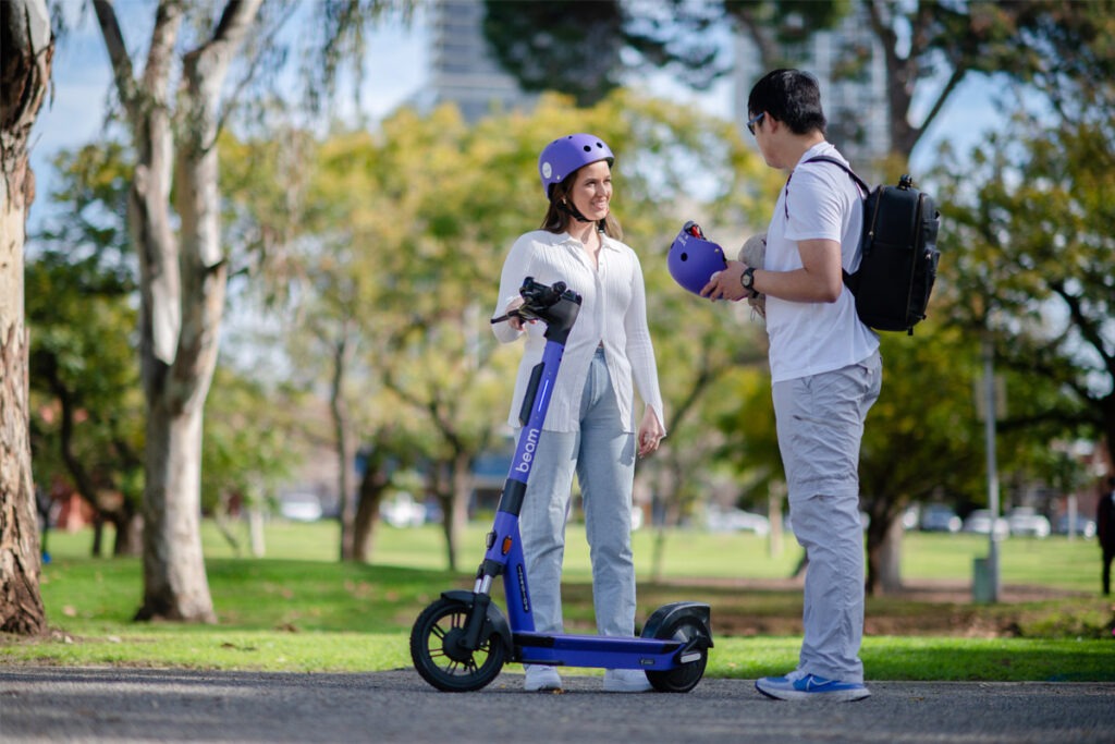 Two people with e-scooter