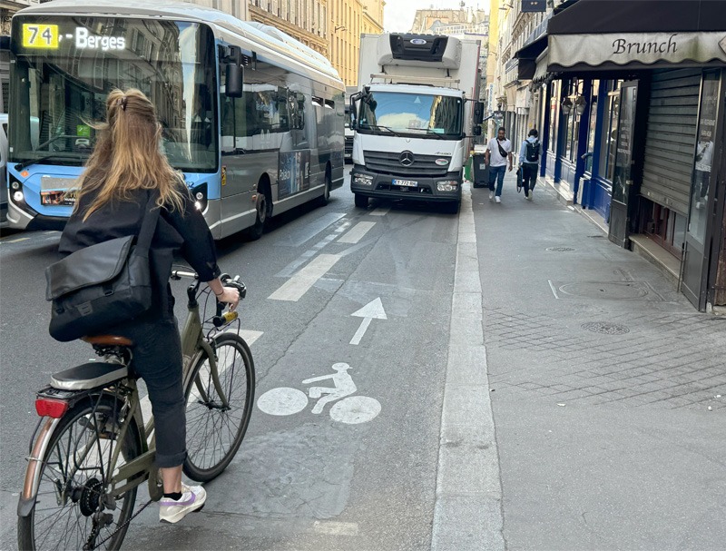 Delivery van parked across a bicycle lane.