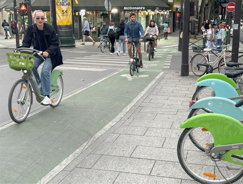 Bike share dock on street.