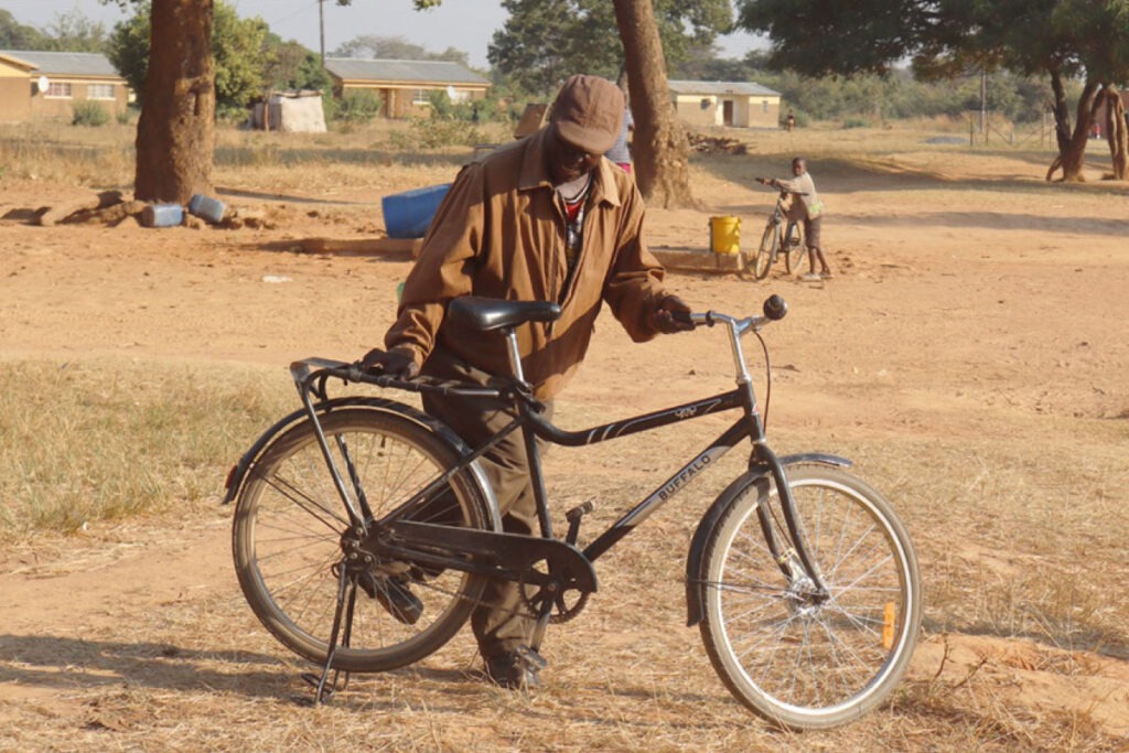 A person in Africa with bicycle