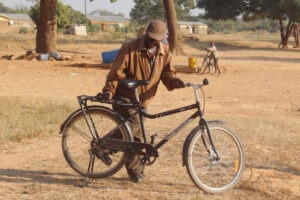 A person in Africa with bicycle