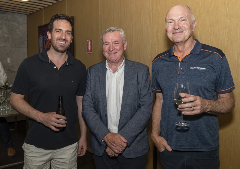 Three men standing for portrait