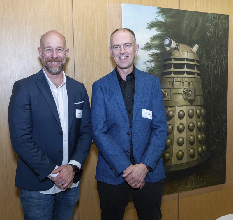 Two men standing for portrait