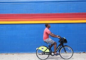 Person riding a share scheme bicycle